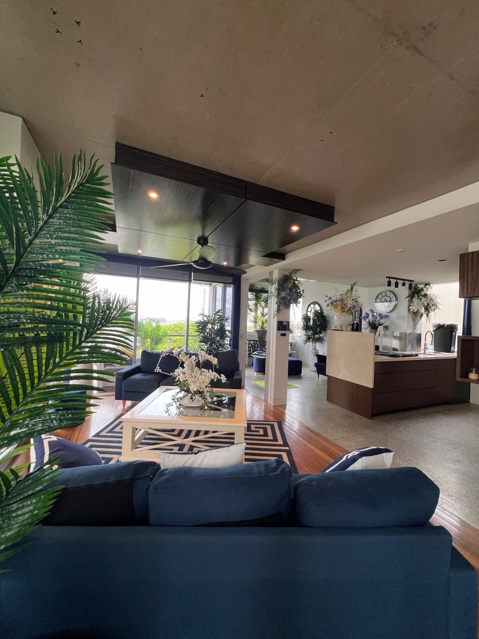 living room with blue sofa